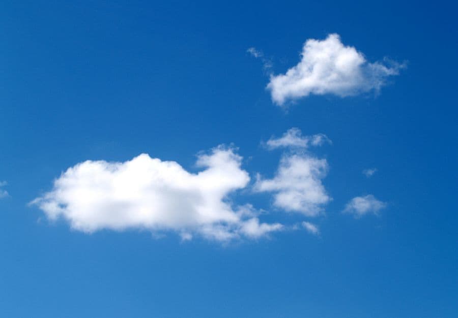 White clouds in a clear blue sky